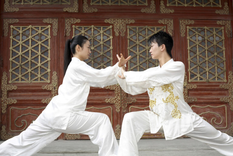 Man and woman practising martial arts